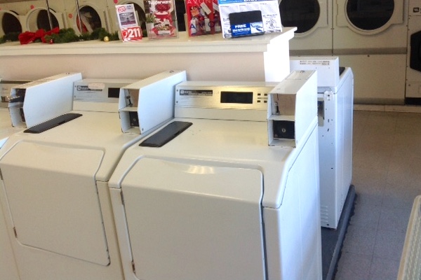 Sebastian Pelican Laundromat customers argue over shared folding table.