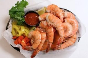 Barbara Hohmann who won two Bottomless All You Can Eat Shrimp Meals at The Old Fish House Bar and Grill in Grant, Florida.