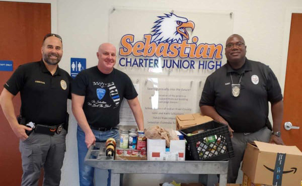 Sergeant Todd Finnegan, Principal William Dodds, and Officer Donald Hart.