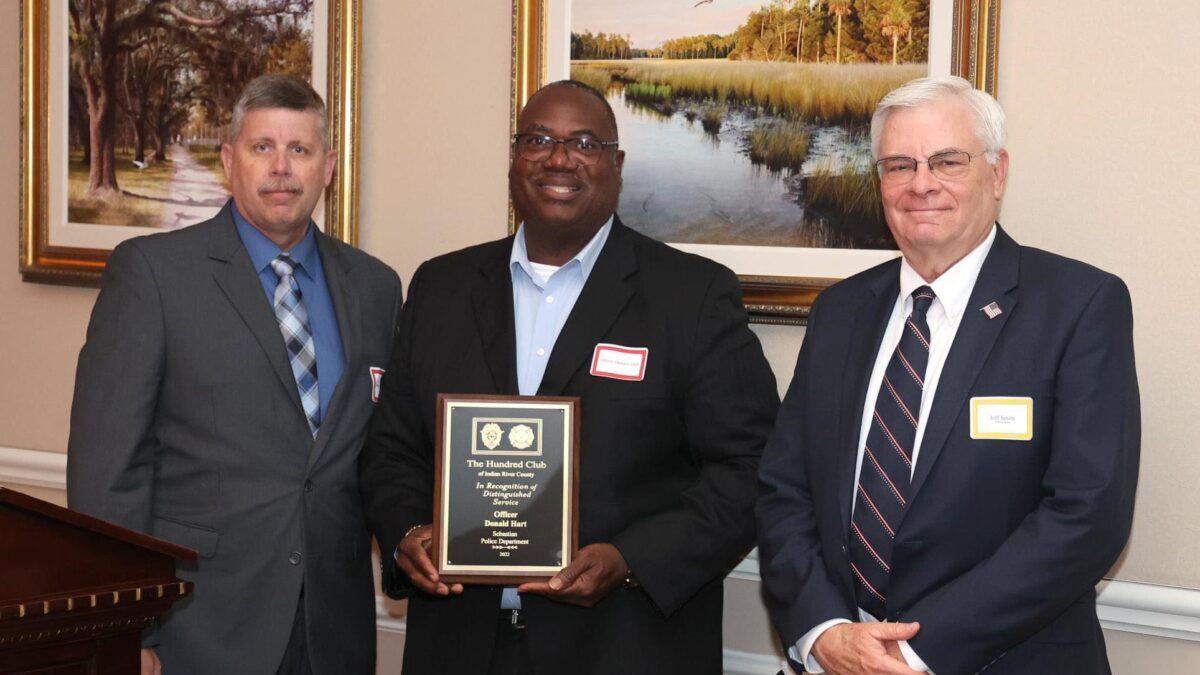 Donald Hart, center, received the Officer of the Year award.