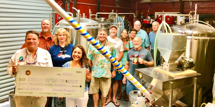 Pareidolia Brewing Company presents check to Hibiscus Children's Center