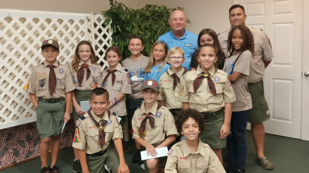 Councilman Ed Dodd (in the blue shirt) answers questions from Sebastian Cub Scouts