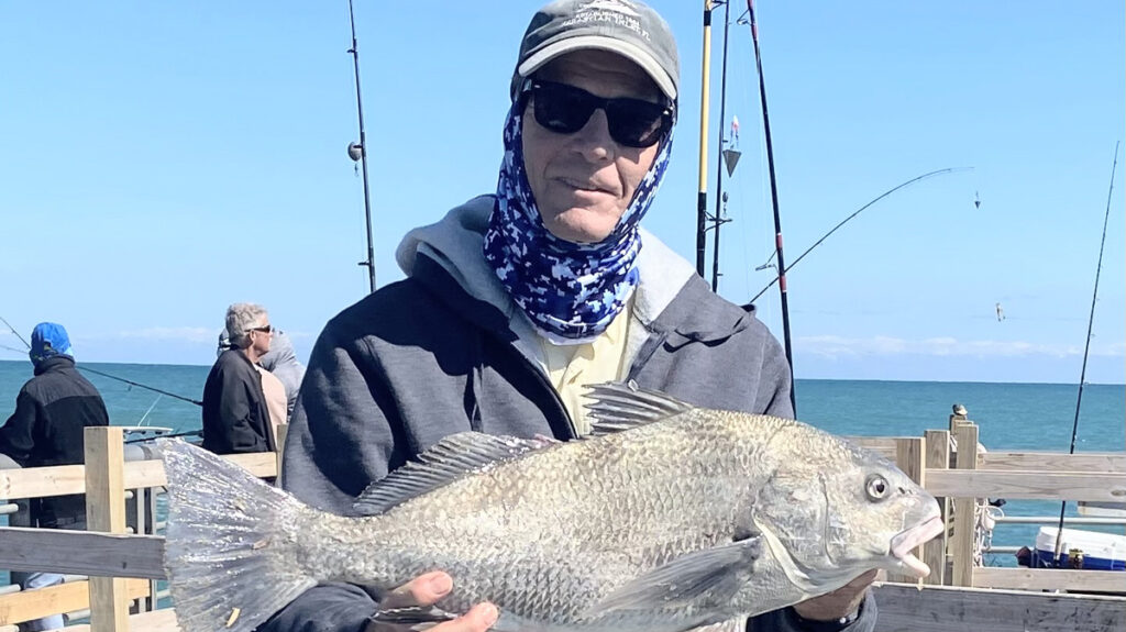 Kirby Kitchener with a black drum at the Sebastian Inlet