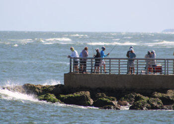 Anglers fishing on the South Jetty of the Sebastian Inlet.