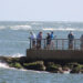 Anglers fishing on the South Jetty of the Sebastian Inlet.