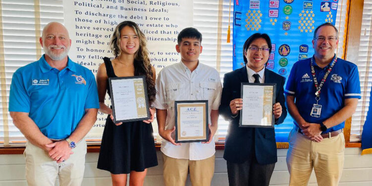 Pictured: Student Coordinator Adam Preuss with Mia Harrel, Sebastian Ramos, Ace McLain and Jaime Sturgeon, SRHS IB Counselor