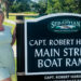 Scarlett Chesser in front of the Capt. Robert Hardee Main Street Ramp sign, marking a notable spot in the city