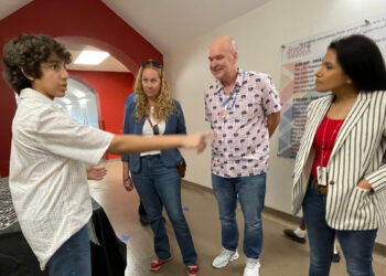 Alina Zaidi talks with Indian River County Superintendent Dr. David Moore and other attendees.